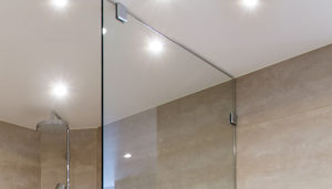 Glass Clamps in Frameless Shower Enclosure and Wine Cellar Components